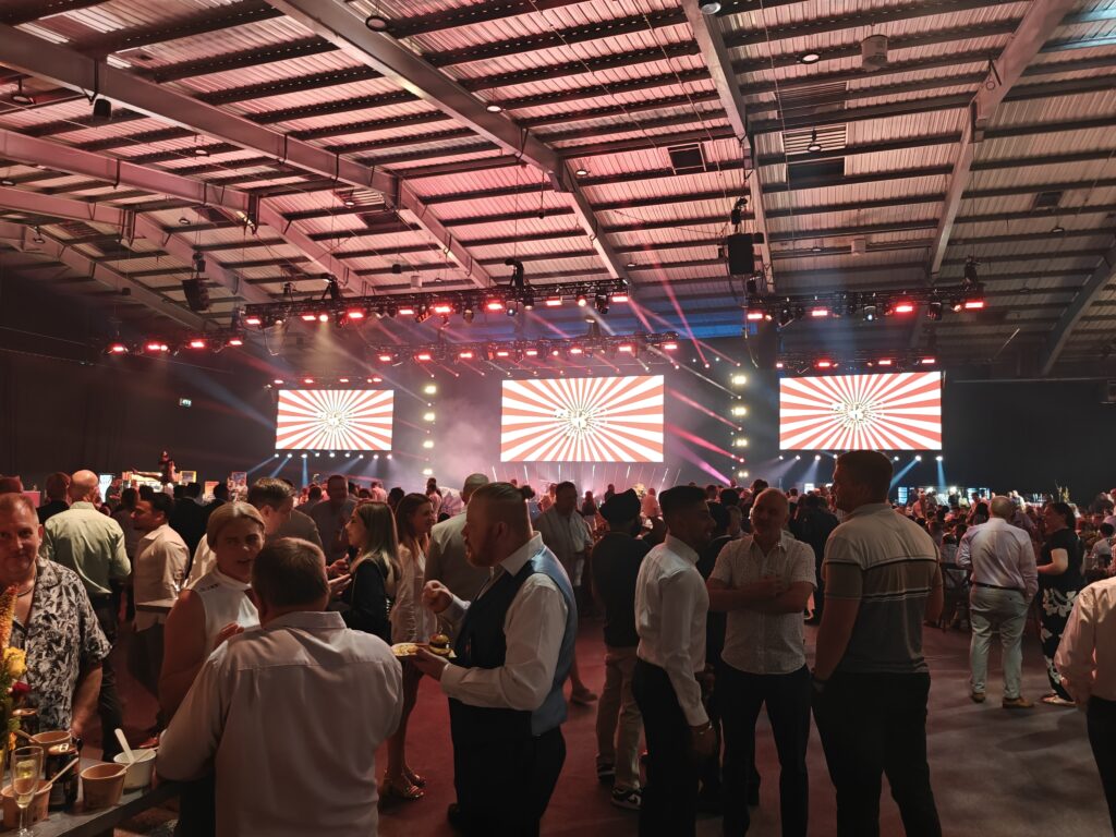 SRS Party night 2025: guests in front of the stage and screens